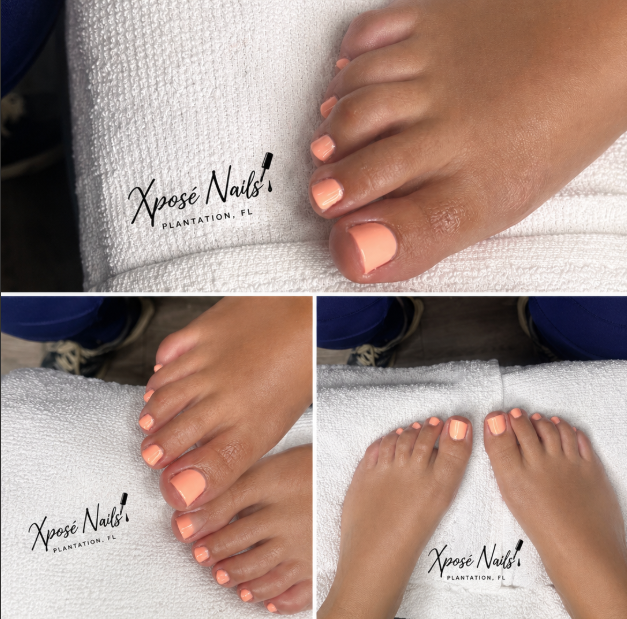 Xposé Nails pedicure work: coral polish on freshly finished toes